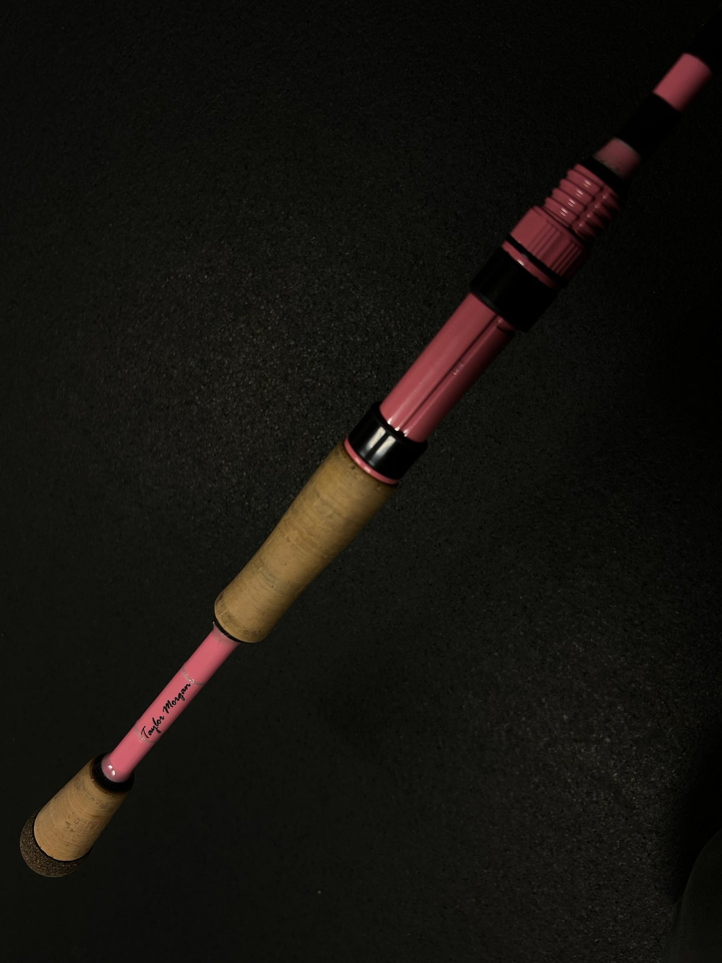 Pink blank with black guide wraps and a custom name add on